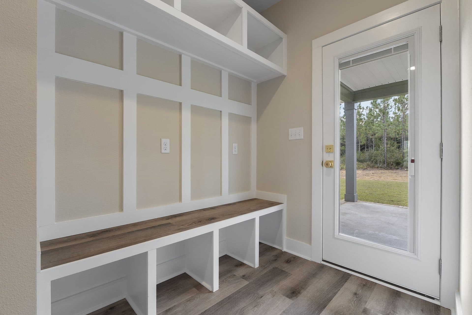 Mud bench with board-and-batten panelling and cubbies by the back door of The Ashley